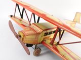 a toy airplane that is sitting on a white surface