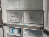 an open refrigerator with its door open in a kitchen