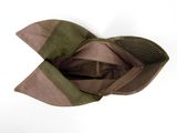 a brown and green hat on a white surface