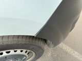 a close up of a car ' s tire with a hole in it