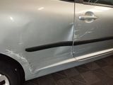 a silver car with a black stripe on the side of it