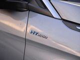 a close up of a car ' s emblem on the side of the car