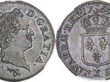 a close up of a coin with a crown on top of it
