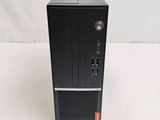 the computer is sitting on a white surface with a white wall in the background