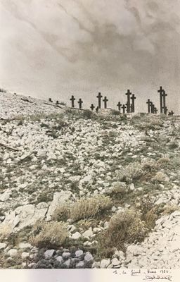 a lot of crosses on a hill in the middle of nowhere