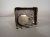 a small metal object that is sitting on a table