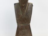 an old bronze statue of a man with a hat on it ' s head