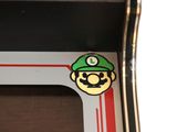 a sticker on the side of a train that has a mario bros sticker on it