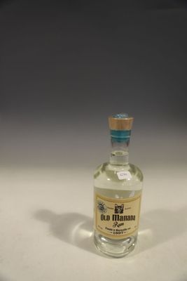 a small bottle of alcohol sitting on a table