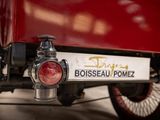 a close up of a red truck with a sign on it