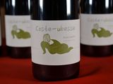 several bottles of wine are lined up on a table