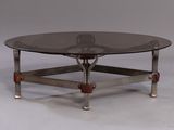 an image of a coffee table with a glass top and metal legs