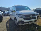 a white van that is parked in a parking lot