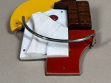 a picture of a necklace with a chocolate bar and a t - shirt on it