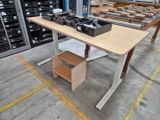 a table with a lot of boxes on it in a warehouse