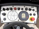 a close up of a steering wheel with a clock on it