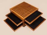 three wooden trays stacked on top of each other on a white surface