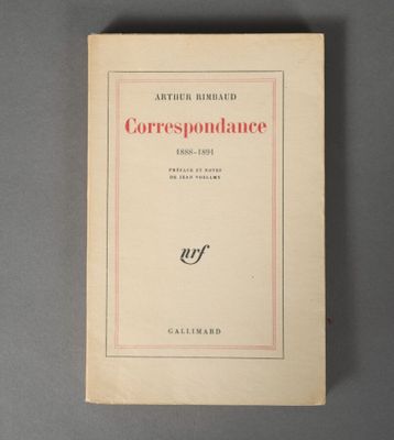 an old book on a table with a red border