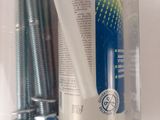 a bottle of toothpaste and a tooth brush in a package
