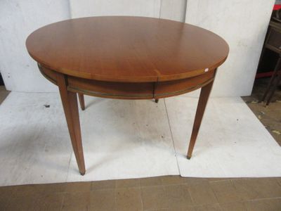 a wooden table with a wooden top on a white rug