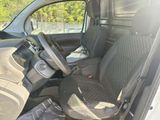the interior of a car with a seat belt and a steering wheel