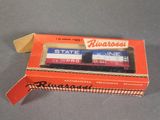 a box with two train cars in it on a table
