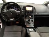 the interior of a car with a steering wheel and dashboard controls