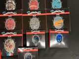 a lot of badges that are on a black table