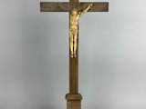 a wooden cross with a crucif on top of it
