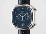 a close up of a watch with a blue face and black leather strap