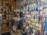 many different types of ribbons on the wall in this store