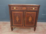 an antique wooden cabinet with two doors and two drawers