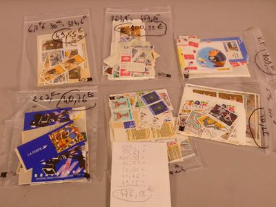many postcards and envelopes that are on the table