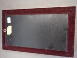 a picture of a mirror hanging on a wall