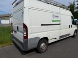 a white van that is parked on the side of the road