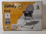a box that has a baby high chair inside of it