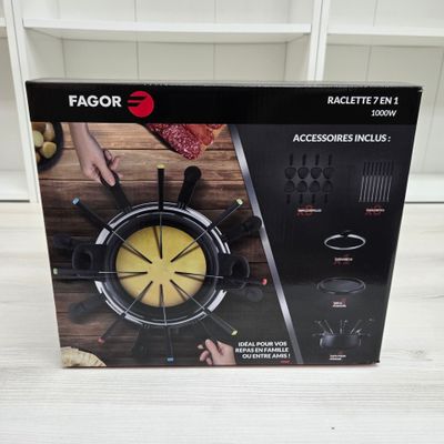the box is open to show the contents of a kitchen gadgetr