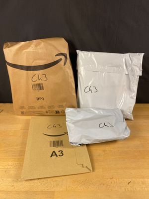 two bags of food sitting on top of a table next to a bag of food