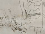 a drawing of a face on a piece of paper