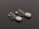 a pair of oplite and diamond earrings