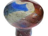 a glass ball that is sitting on top of a table