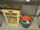 a trash can sitting next to a trash can on the floor