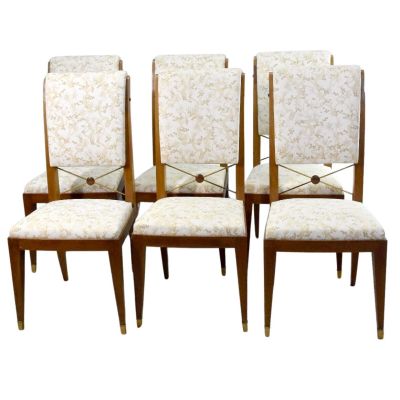 set of four mid - century style dining chairs with upholstered upholstered seats