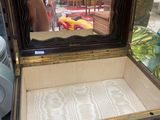 a small wooden box with a mirror on top of it