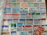 a picture of a picture of a bunch of stamps on the wall