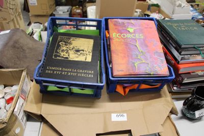 several books are stacked on top of each other on a table
