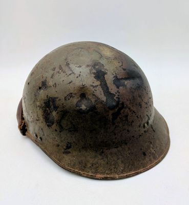 a close up of a helmet on a white surface