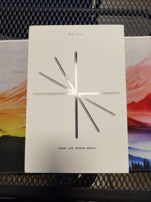 an image of a white clock sitting on top of a table