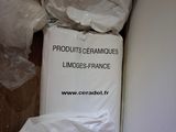 a pile of white bags sitting on top of a white box