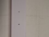 a picture of a white electrical outlet on a wall